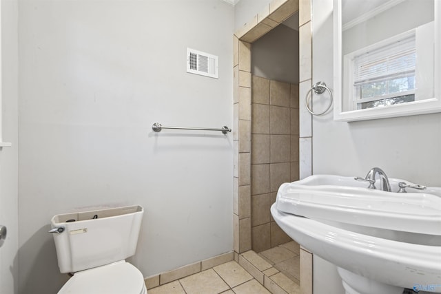 bathroom with tile patterned floors, toilet, and sink