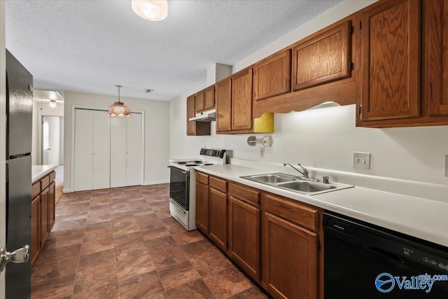 kitchen featuring hanging light fixtures, sink, a textured ceiling, and black appliances