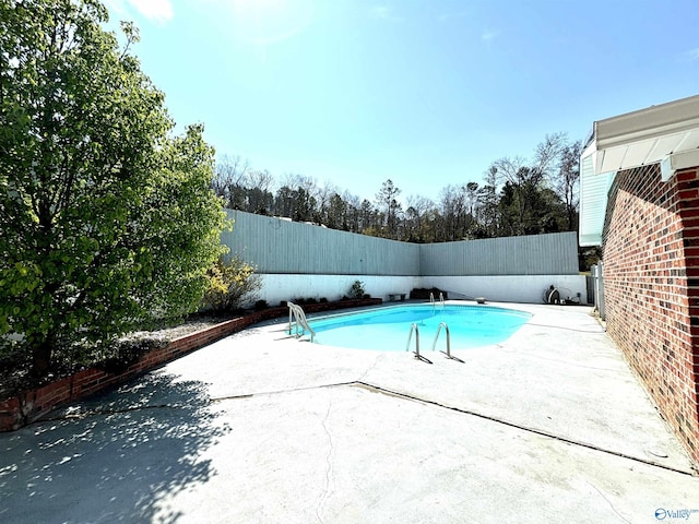 view of pool with a patio, a fenced in pool, and a fenced backyard