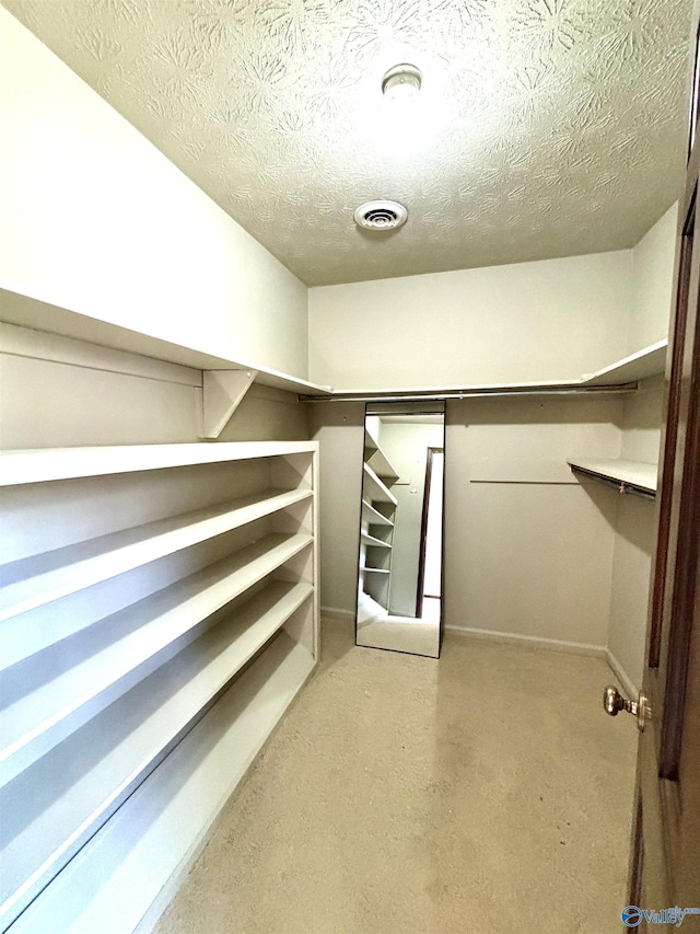 walk in closet with visible vents