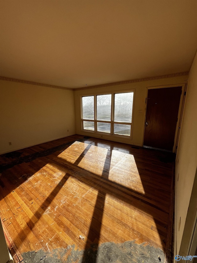 empty room with wood finished floors