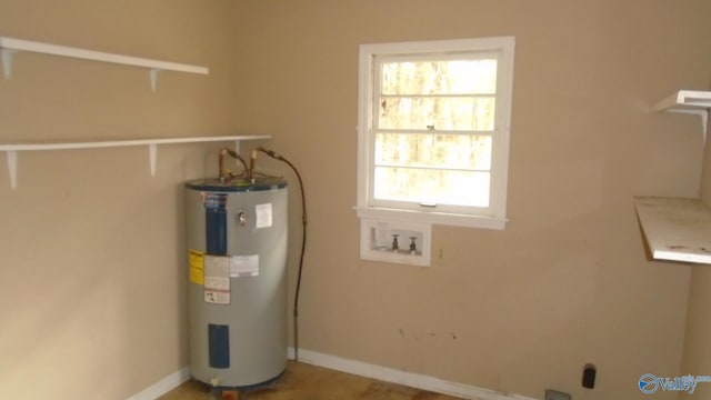 utility room featuring water heater