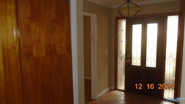 tiled entryway with crown molding