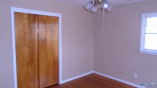 unfurnished bedroom featuring dark hardwood / wood-style floors