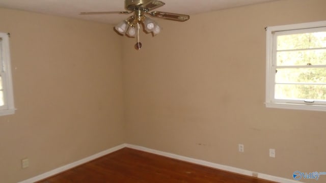 unfurnished room featuring ceiling fan and hardwood / wood-style flooring