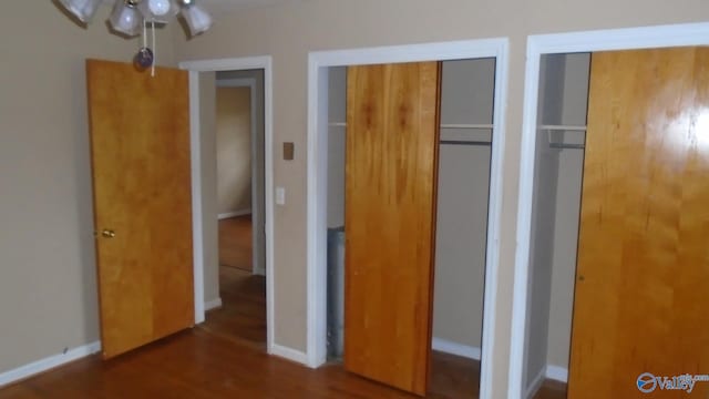 unfurnished bedroom featuring dark hardwood / wood-style floors