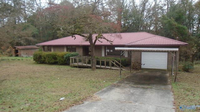 single story home featuring a garage and a front yard