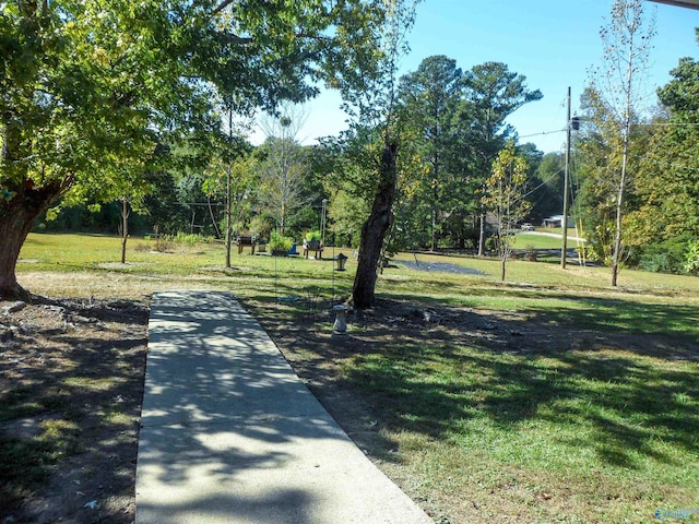 surrounding community featuring a lawn