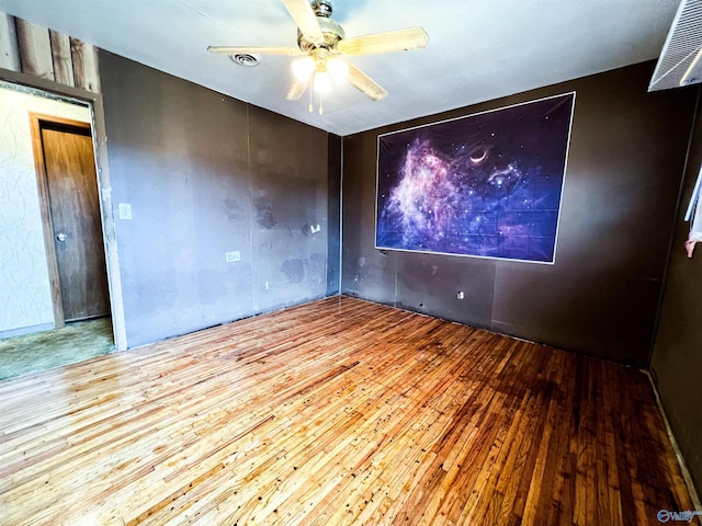 unfurnished room featuring ceiling fan and light wood-type flooring