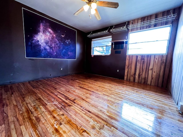 spare room with hardwood / wood-style floors and ceiling fan