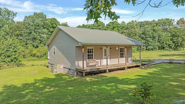 1073 6th St S, Sylvania, AL 35988 - view of front of property with crawl space, a front lawn, a metal roof, and covered porch