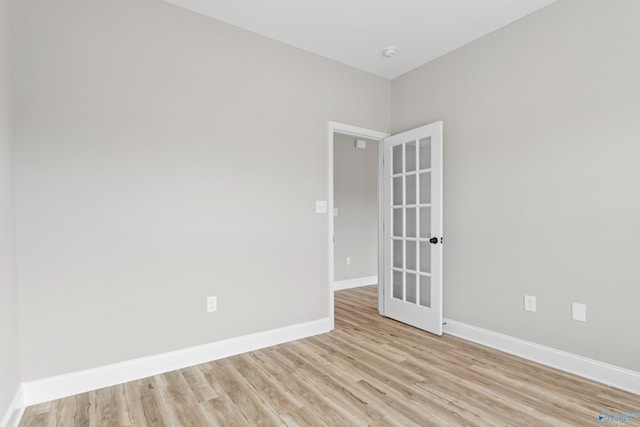 unfurnished room with light wood-type flooring