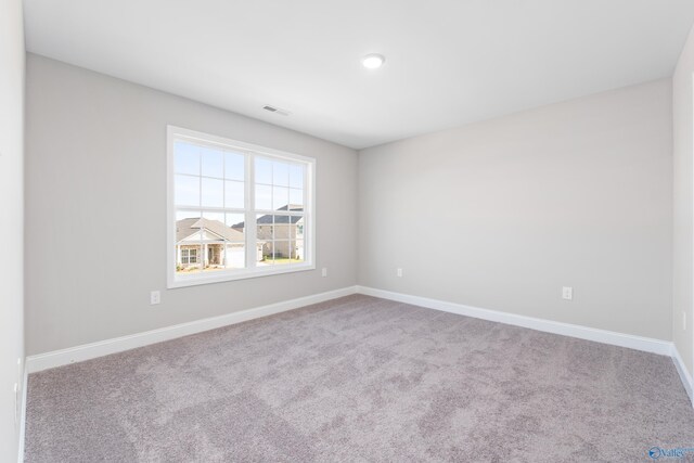 unfurnished bedroom with light carpet