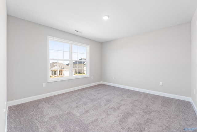 empty room with light colored carpet