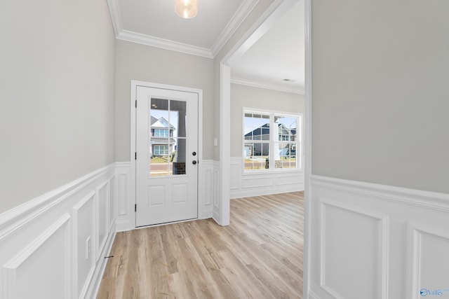 entryway with crown molding and light wood-type flooring