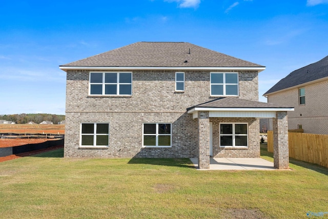 rear view of property with a patio area and a yard