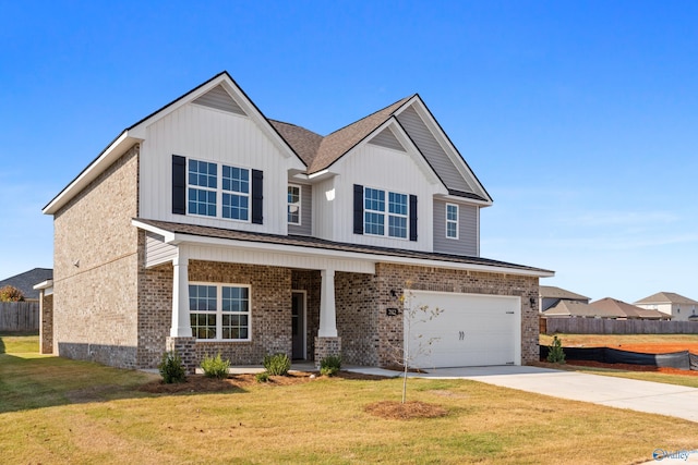 craftsman inspired home featuring a garage and a front lawn