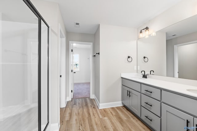 kitchen with plenty of natural light, sink, a kitchen island with sink, and dishwasher