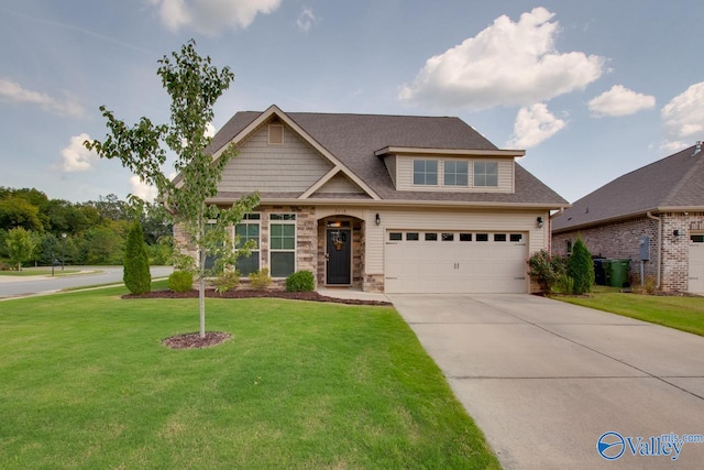 craftsman house featuring a garage and a front lawn