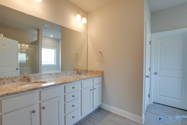 bathroom featuring double sink vanity and tile patterned flooring