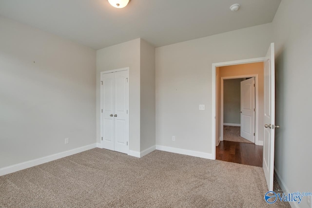 unfurnished bedroom with carpet and a closet