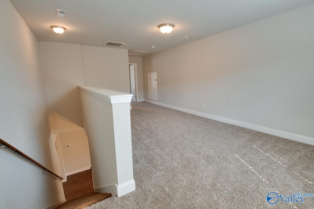 spare room with light colored carpet