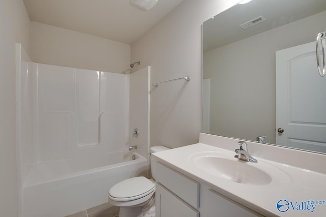 full bathroom with bathing tub / shower combination, toilet, vanity, and tile patterned floors