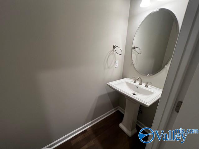 bathroom featuring sink and hardwood / wood-style flooring