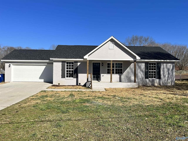 view of front of house with driveway, covered porch, an attached garage, a front yard, and brick siding