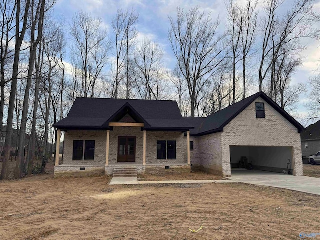 view of front of house featuring a garage and covered porch