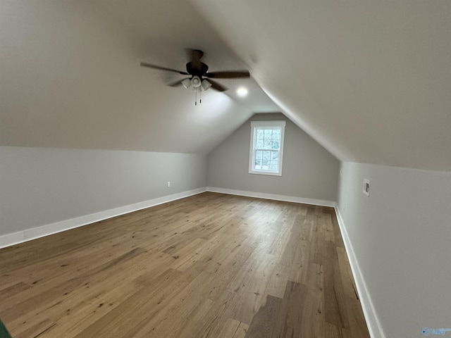 bonus room featuring vaulted ceiling, hardwood / wood-style floors, and ceiling fan