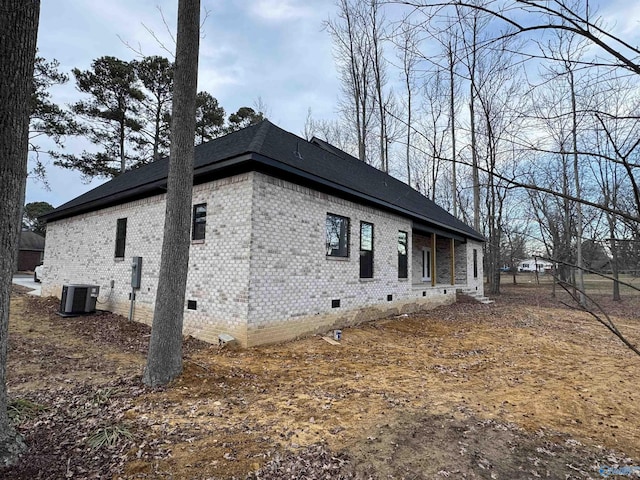 view of side of home featuring central AC unit