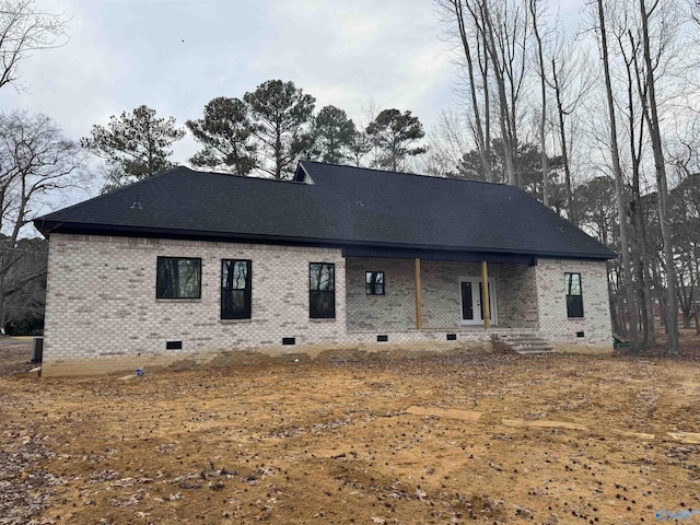 rear view of property with a porch