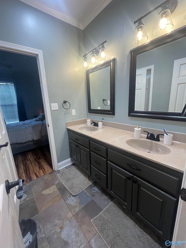 bathroom featuring ornamental molding and vanity