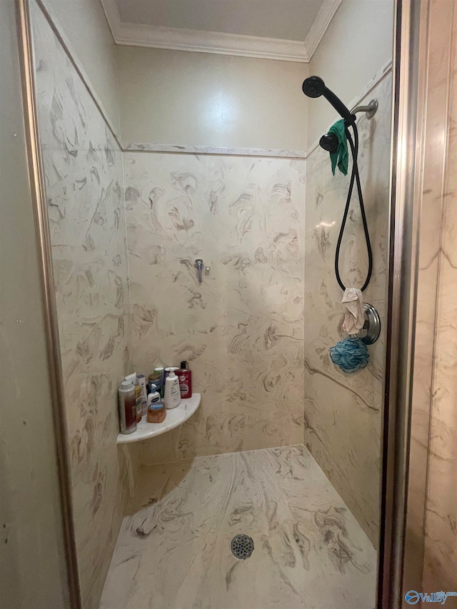 bathroom featuring crown molding and walk in shower