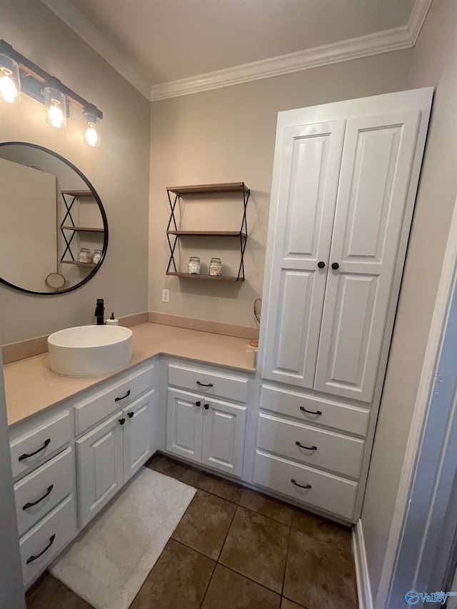 bathroom featuring crown molding, vanity, and tile patterned flooring