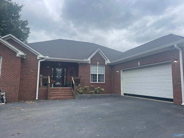 ranch-style house featuring a garage