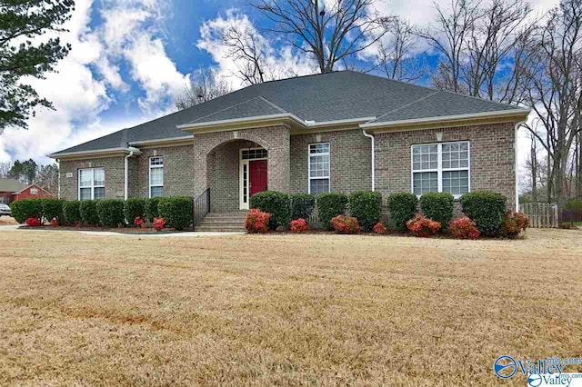 238 Riverwalk Trl, New Market, AL 35716 - view of front of home with brick siding, a front lawn, and roof with shingles