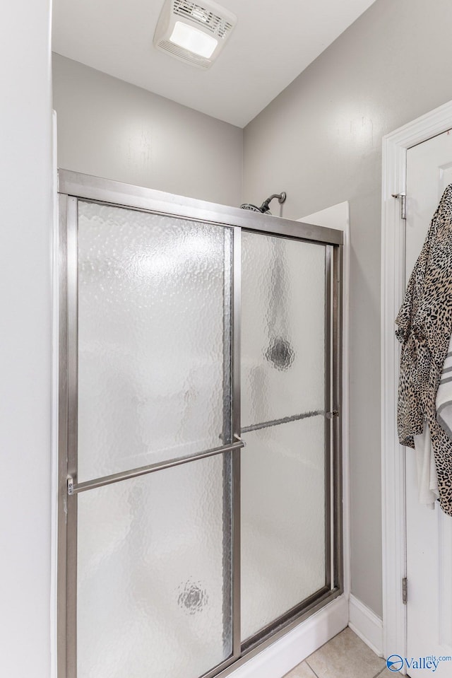 238 Riverwalk Trl, New Market, AL 35716 - bathroom with a stall shower and tile patterned floors