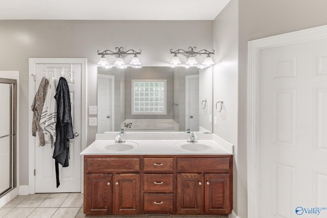 238 Riverwalk Trl, New Market, AL 35716 - full bathroom with tile patterned flooring, a bath, double vanity, and a stall shower