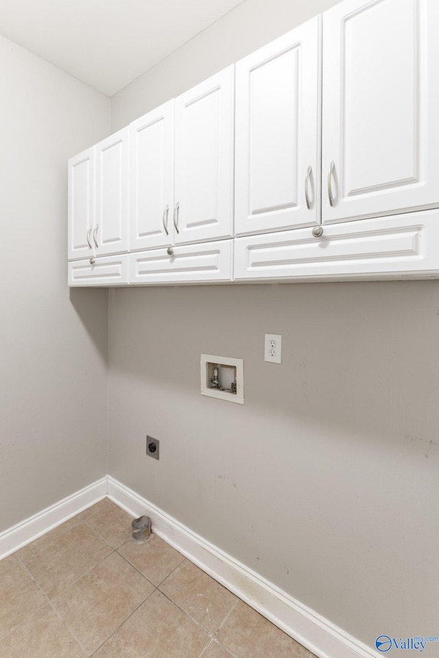 238 Riverwalk Trl, New Market, AL 35716 - laundry area with cabinet space, hookup for an electric dryer, hookup for a washing machine, and light tile patterned floors