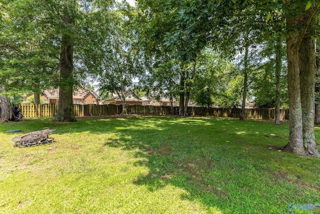 238 Riverwalk Trl, New Market, AL 35716 - fenced backyard with an outdoor fire pit