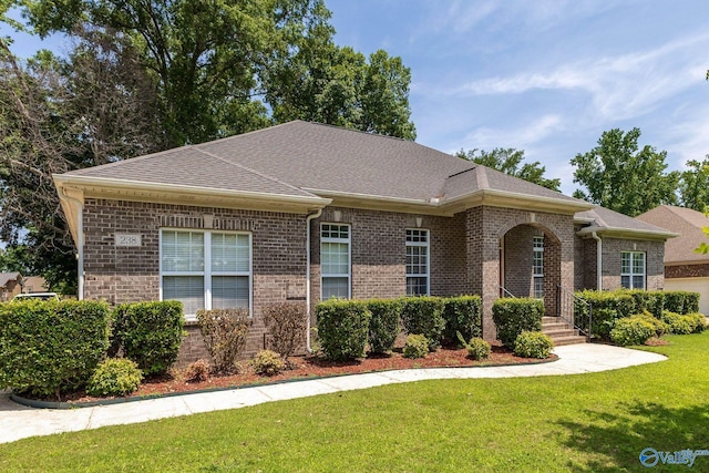 238 Riverwalk Trl, New Market, AL 35716 - view of front facade with brick siding, a front yard, and roof with shingles
