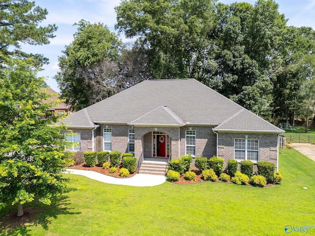 238 Riverwalk Trl, New Market, AL 35716 - french country home featuring a front yard, brick siding, and roof with shingles