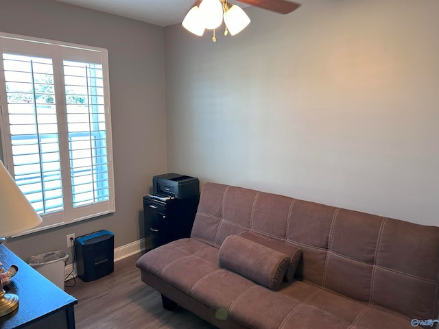 living room featuring ceiling fan, a healthy amount of sunlight, and hardwood / wood-style flooring