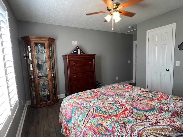 bedroom featuring a textured ceiling, ceiling fan, and hardwood / wood-style floors