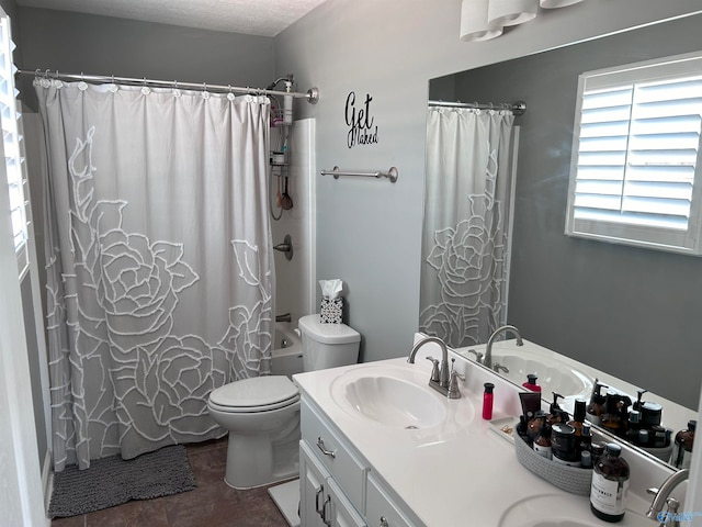 bathroom featuring tile patterned flooring, vanity, and toilet