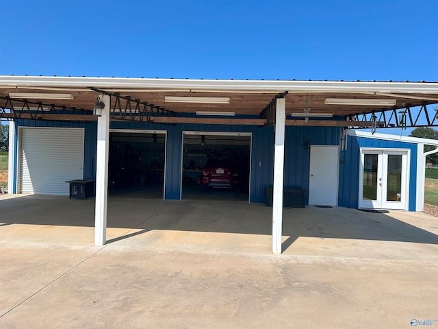 rear view of house with a carport and french doors