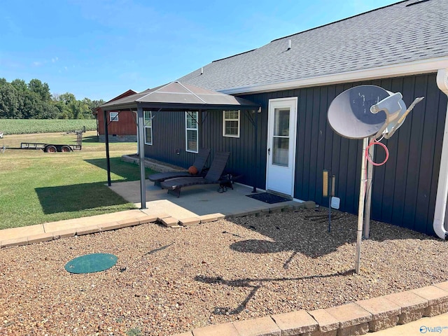 back of house with a patio area, a yard, and a gazebo