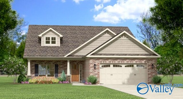 view of front of property with a garage and a front lawn